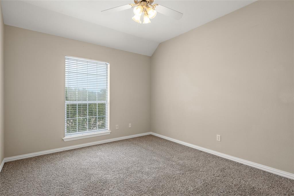 1001 Krenek Tap Road, Unit 801 College Station, TX 77840 - Photo 13 of 21 an empty room with a window and a ceiling fan