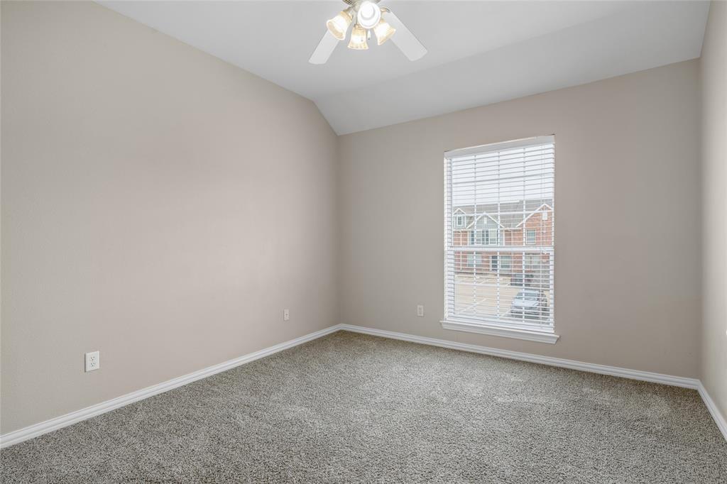 1001 Krenek Tap Road, Unit 801 College Station, TX 77840 - Photo 18 of 21 an empty room with a chandelier fan and windows