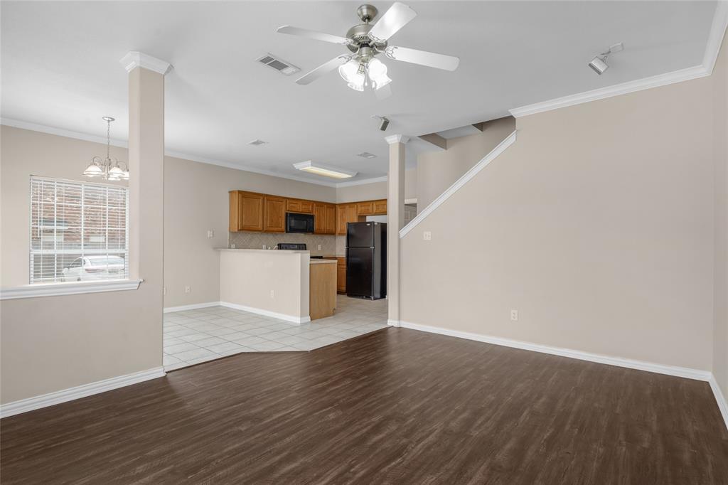 1001 Krenek Tap Road, Unit 801 College Station, TX 77840 - Photo 4 of 21 a view of an empty room with window and wooden floor
