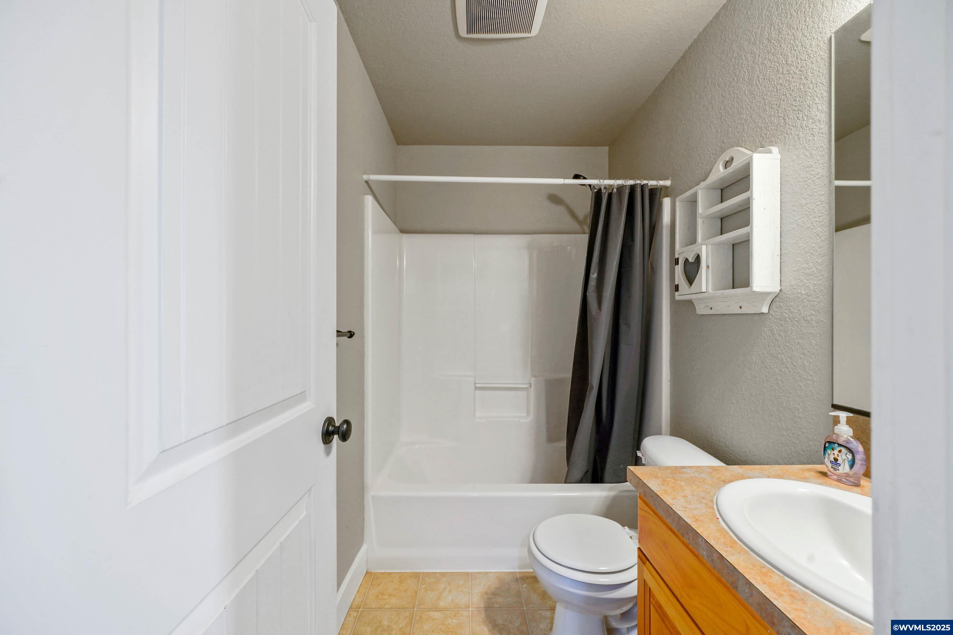 353 Northwest Reed Lane Dallas, OR 97338 - Photo 38 of 45 a bathroom with a sink toilet and shower