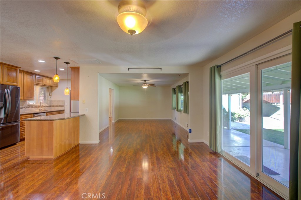 3728 Fuchsia Lane Modesto, CA 95356 - Photo 11 of 47 a view of a room with wooden floor and a window