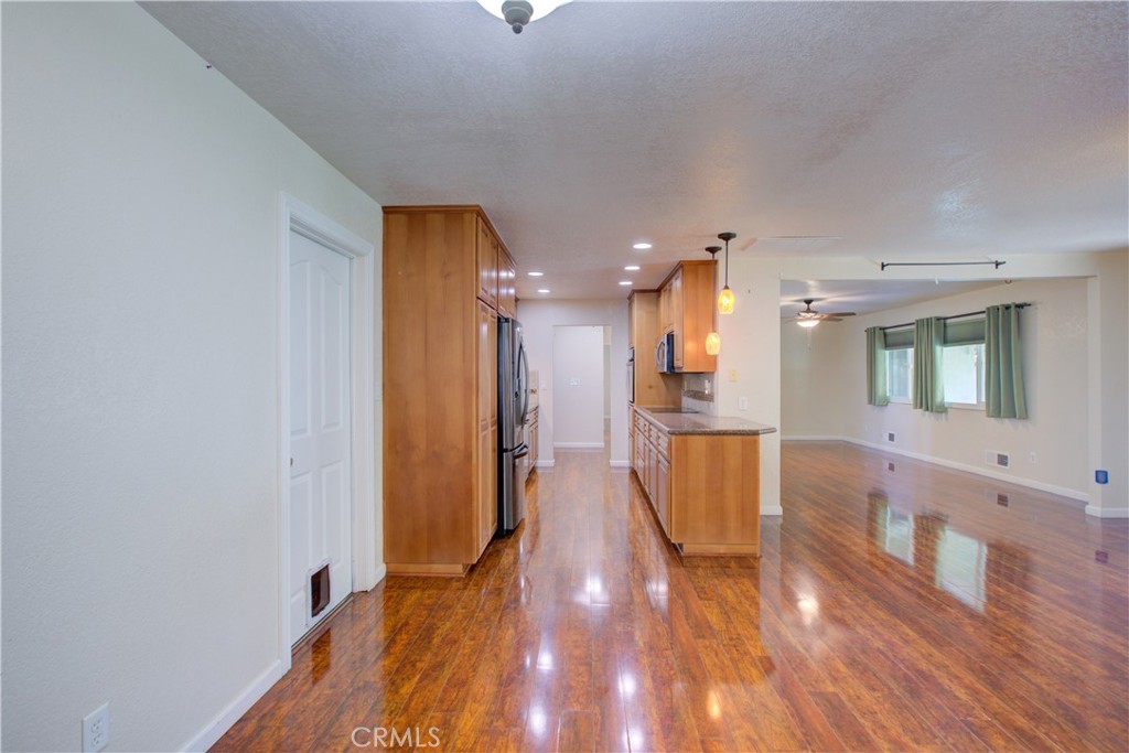 3728 Fuchsia Lane Modesto, CA 95356 - Photo 15 of 47 a view of kitchen and hall with wooden floor