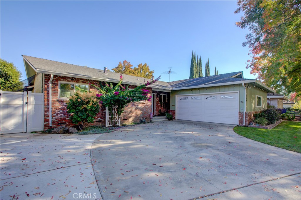 3728 Fuchsia Lane Modesto, CA 95356 - Photo 2 of 47 a view of a house with potted plants and a large parking space