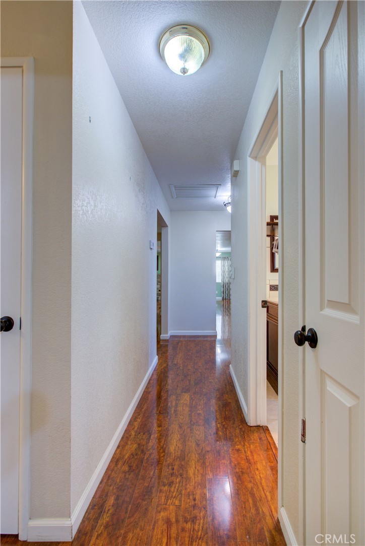 3728 Fuchsia Lane Modesto, CA 95356 - Photo 22 of 47 a view of hallway with wooden floor