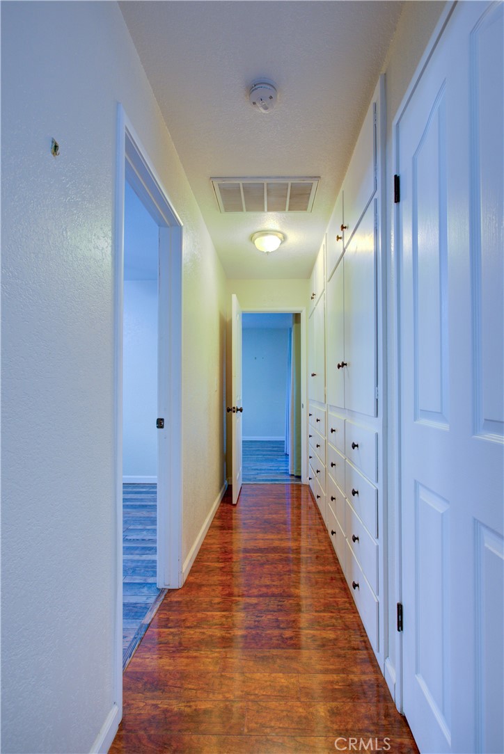 3728 Fuchsia Lane Modesto, CA 95356 - Photo 23 of 47 a view of a hallway with wooden floor