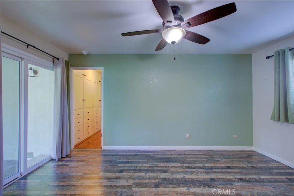 3728 Fuchsia Lane Modesto, CA 95356 - Photo 28 of 47 an empty room with wooden floor and door
