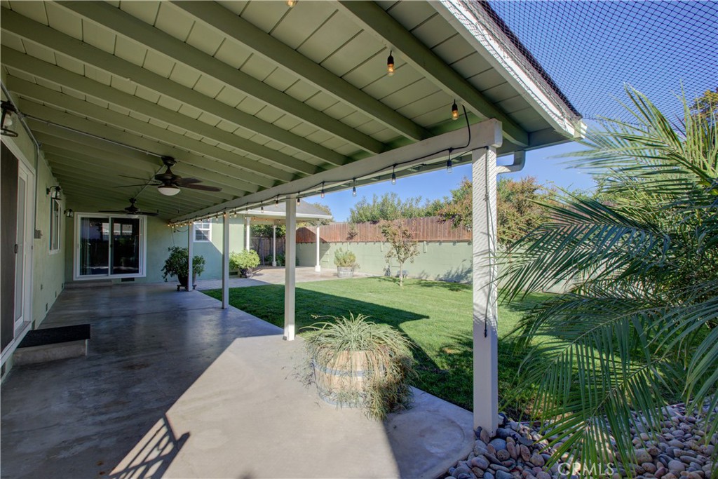 3728 Fuchsia Lane Modesto, CA 95356 - Photo 38 of 47 a view of a porch with a floor to ceiling window and potted plants