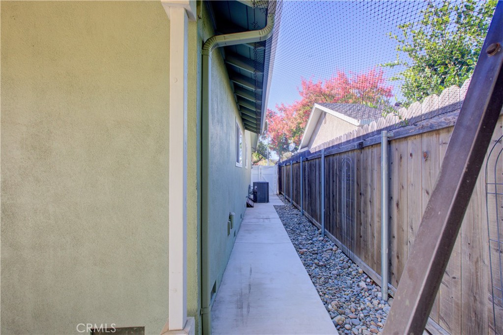3728 Fuchsia Lane Modesto, CA 95356 - Photo 41 of 47 a view of a pathway of a house with wooden fence