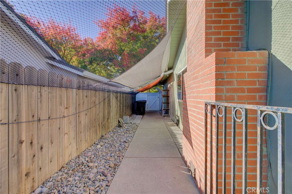 3728 Fuchsia Lane Modesto, CA 95356 - Photo 44 of 47 a view of a pathway of a building with wooden fence