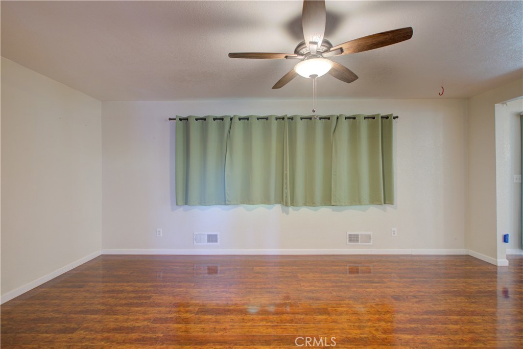 3728 Fuchsia Lane Modesto, CA 95356 - Photo 6 of 47 a bathroom with a window and a ceiling fan