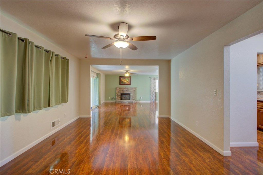 3728 Fuchsia Lane Modesto, CA 95356 - Photo 7 of 47 a view of a livingroom with wooden floor and furniture