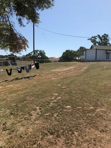 a view of ocean with a building in the background