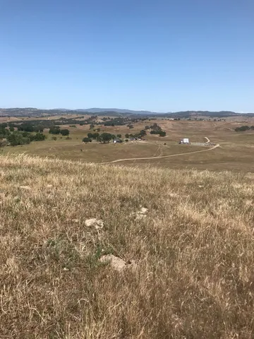 a view of an ocean beach and mountain