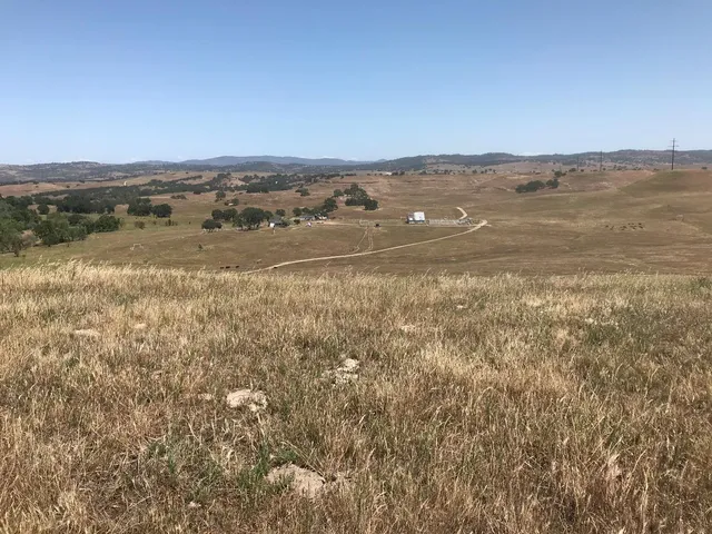 a view of a wooden deck and lake view