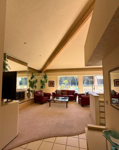 a bathroom with a granite countertop sink mirror and a