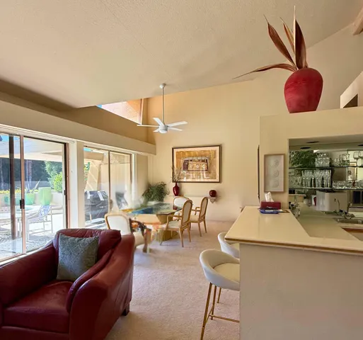 a kitchen with stainless steel appliances kitchen island granite countertop a sink and cabinets