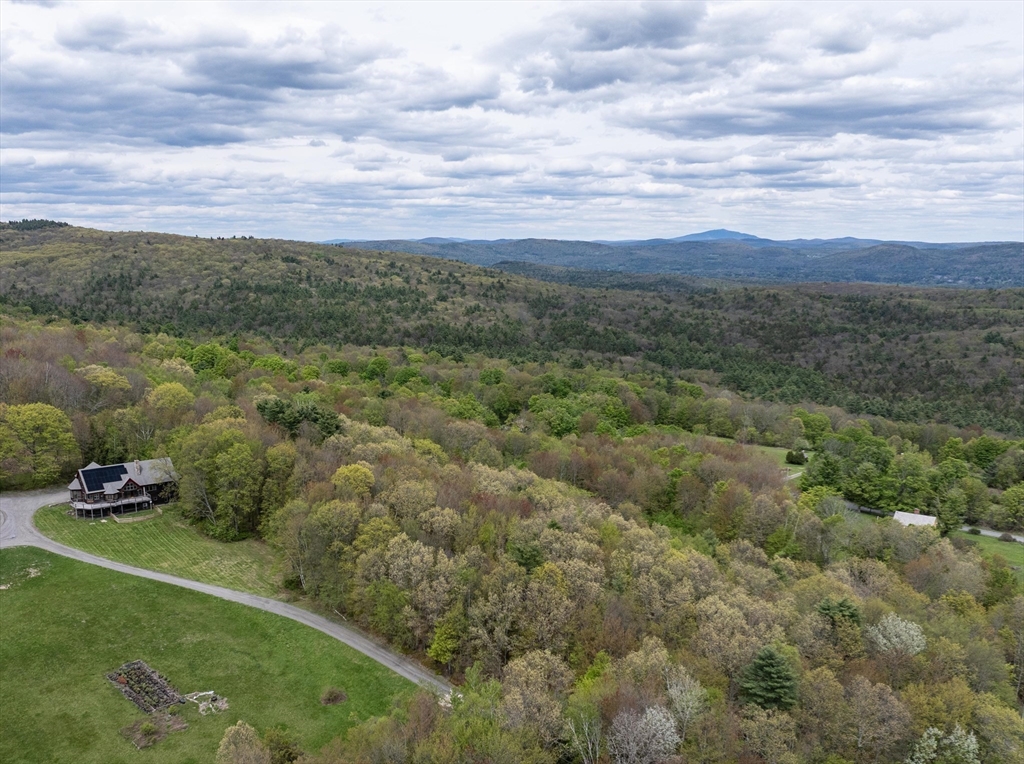 184 W Road Bernardston, MA 01337 - Photo 40 of 41 a view of a green field with lots of trees
