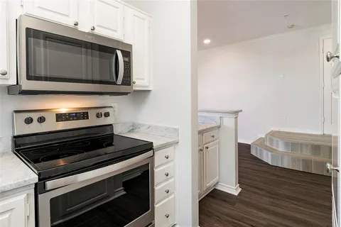 a kitchen with a stove and a microwave