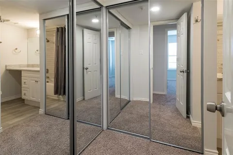 a bathroom with a glass door shower