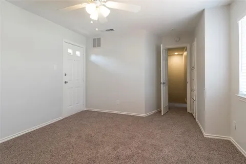 an empty room with a bathroom