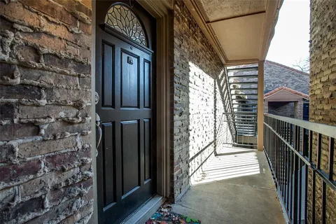 a view of a balcony with door