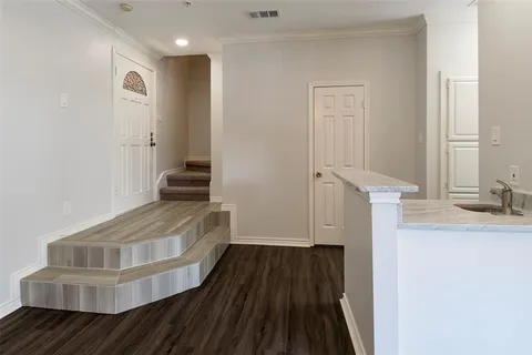 a view of entryway with wooden floor