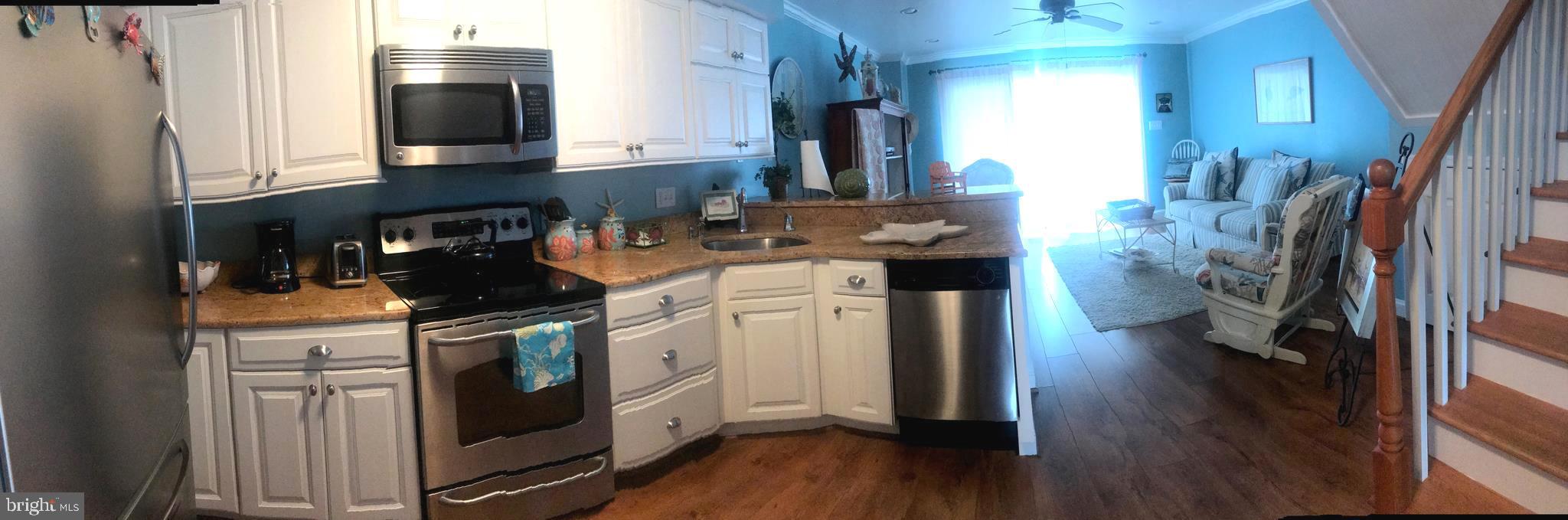 701 Rusty Anchor Road, Unit 21 Ocean City, MD 21842 - Photo 14 of 22 Kitchen and living room area
