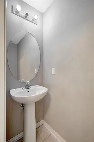 a bathroom with a sink a mirror and vanity