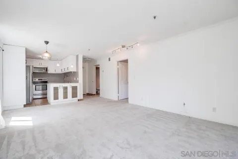 a view of a kitchen with a sink and dishwasher cabinets