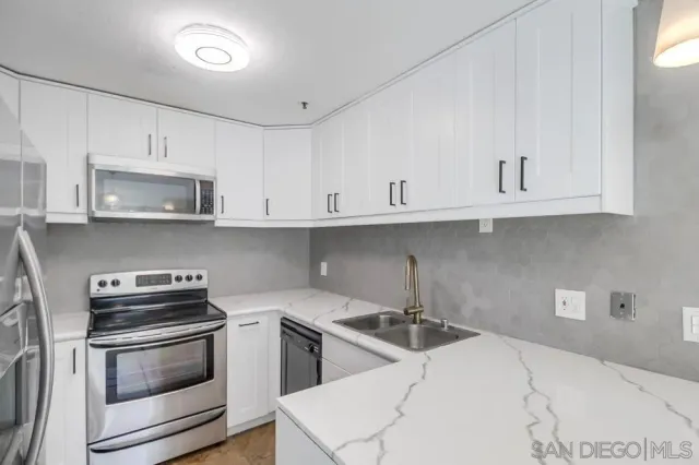 a view of a livingroom with a fireplace and window