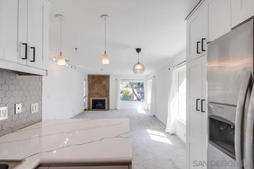 5645 Friars Road, Unit 363 San Diego, CA 92110 - Photo 19 of 74 a view of a livingroom with a fireplace and window