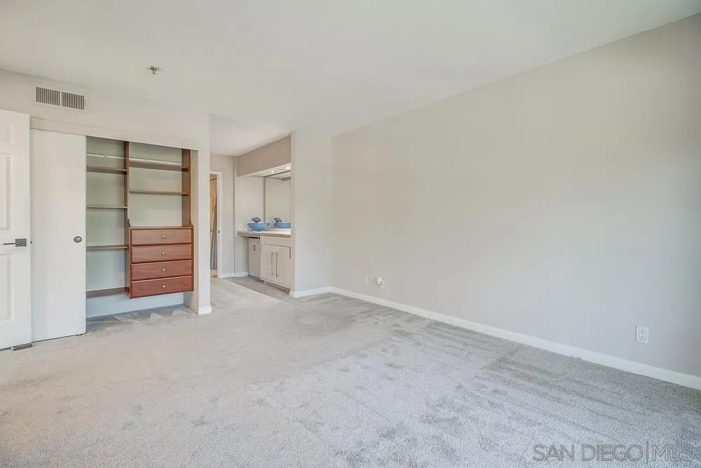 5645 Friars Road, Unit 363 San Diego, CA 92110 - Photo 24 of 74 a view of an empty room with closet and a window