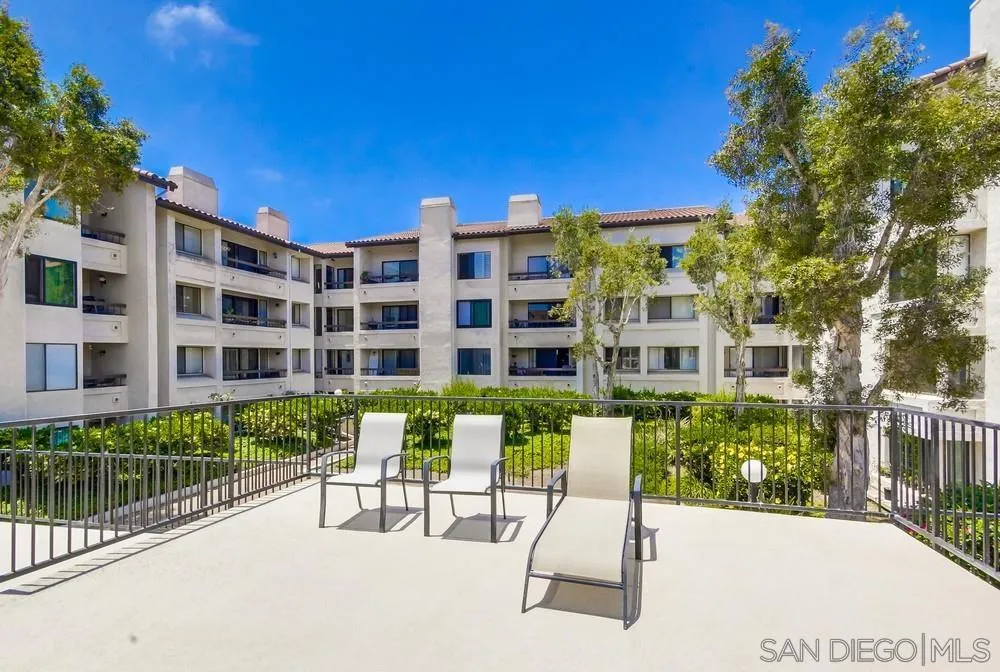 5645 Friars Road, Unit 363 San Diego, CA 92110 - Photo 54 of 74 a view of a building with a bench in a patio