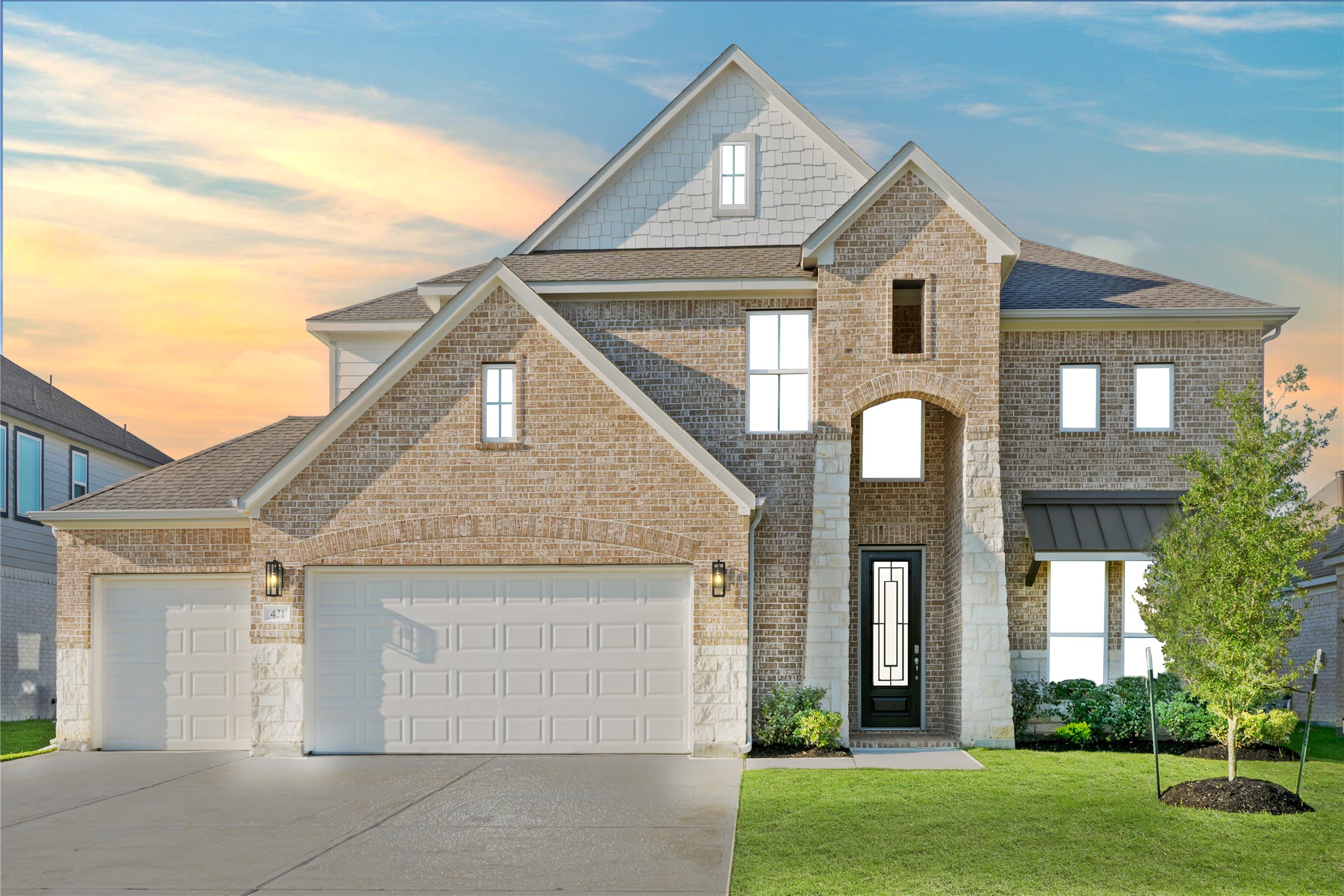 a front view of a house with garden