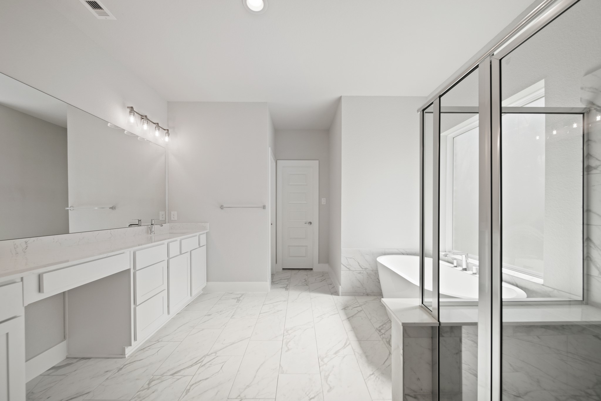 421 Piney Rocks Lane Waller, TX 77484 - Photo 16 of 47 a bathroom with a double vanity sink and mirror