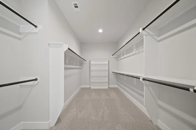a view of an empty walk in closet