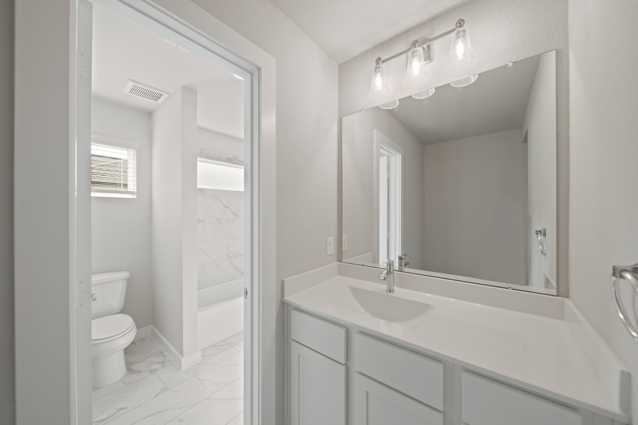 421 Piney Rocks Lane Waller, TX 77484 - Photo 22 of 47 a bathroom with a sink a toilet and a mirror