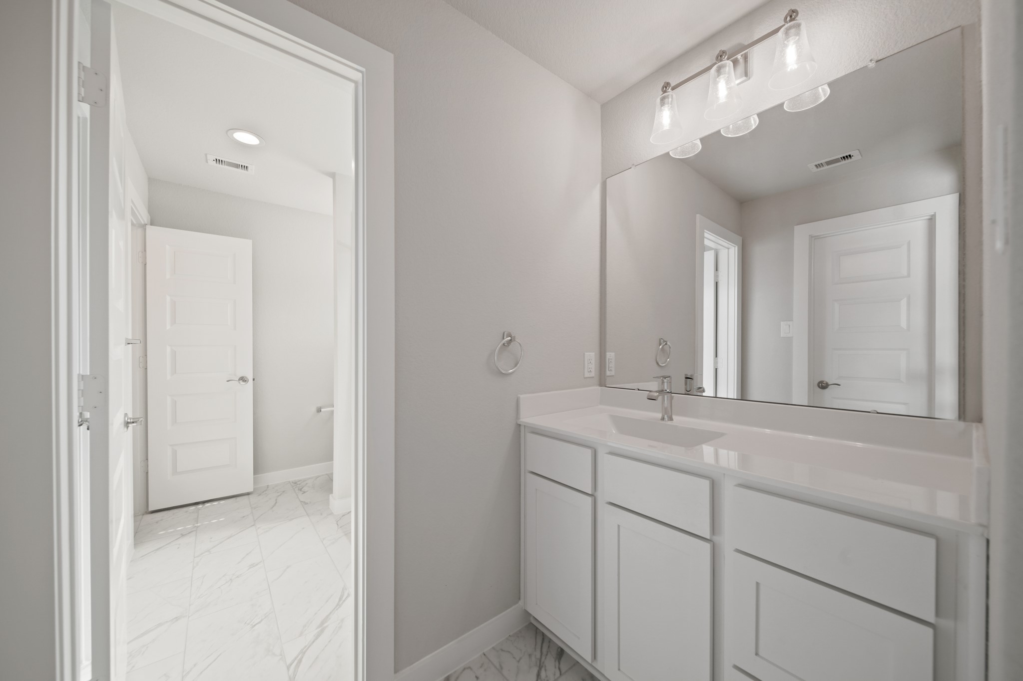 421 Piney Rocks Lane Waller, TX 77484 - Photo 24 of 47 a bathroom with a sink and a mirror