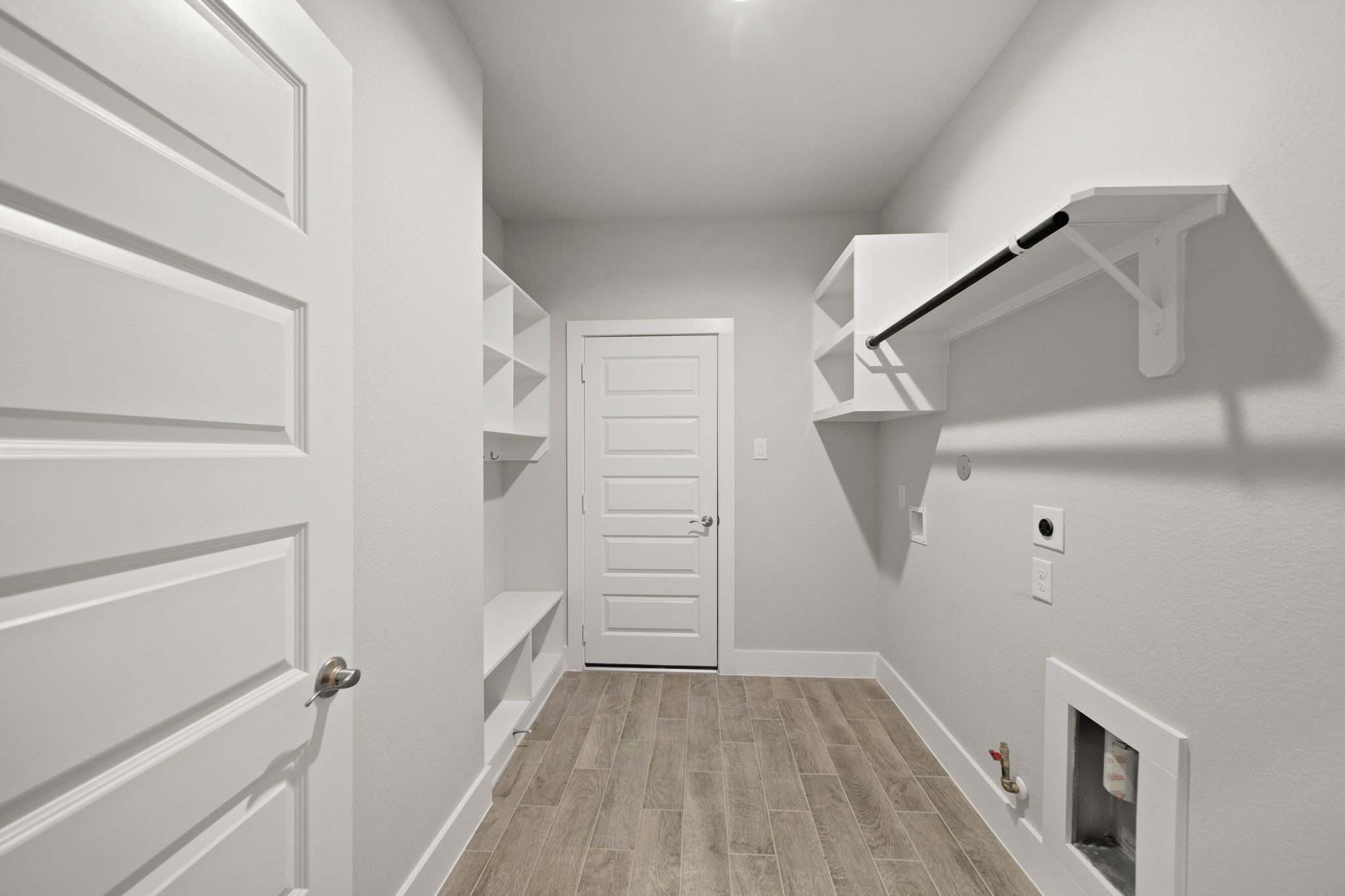 421 Piney Rocks Lane Waller, TX 77484 - Photo 28 of 47 a view of walk in closet with empty racks