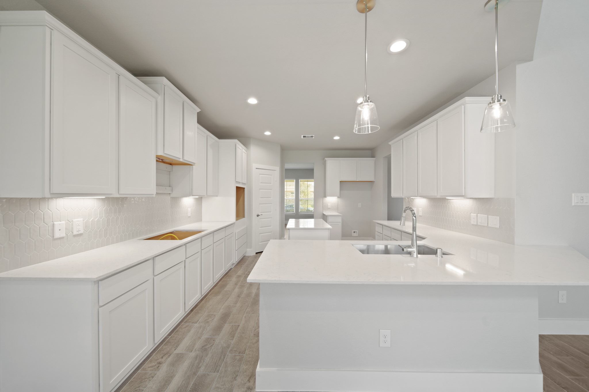 421 Piney Rocks Lane Waller, TX 77484 - Photo 5 of 47 a large white kitchen with stainless steel appliances