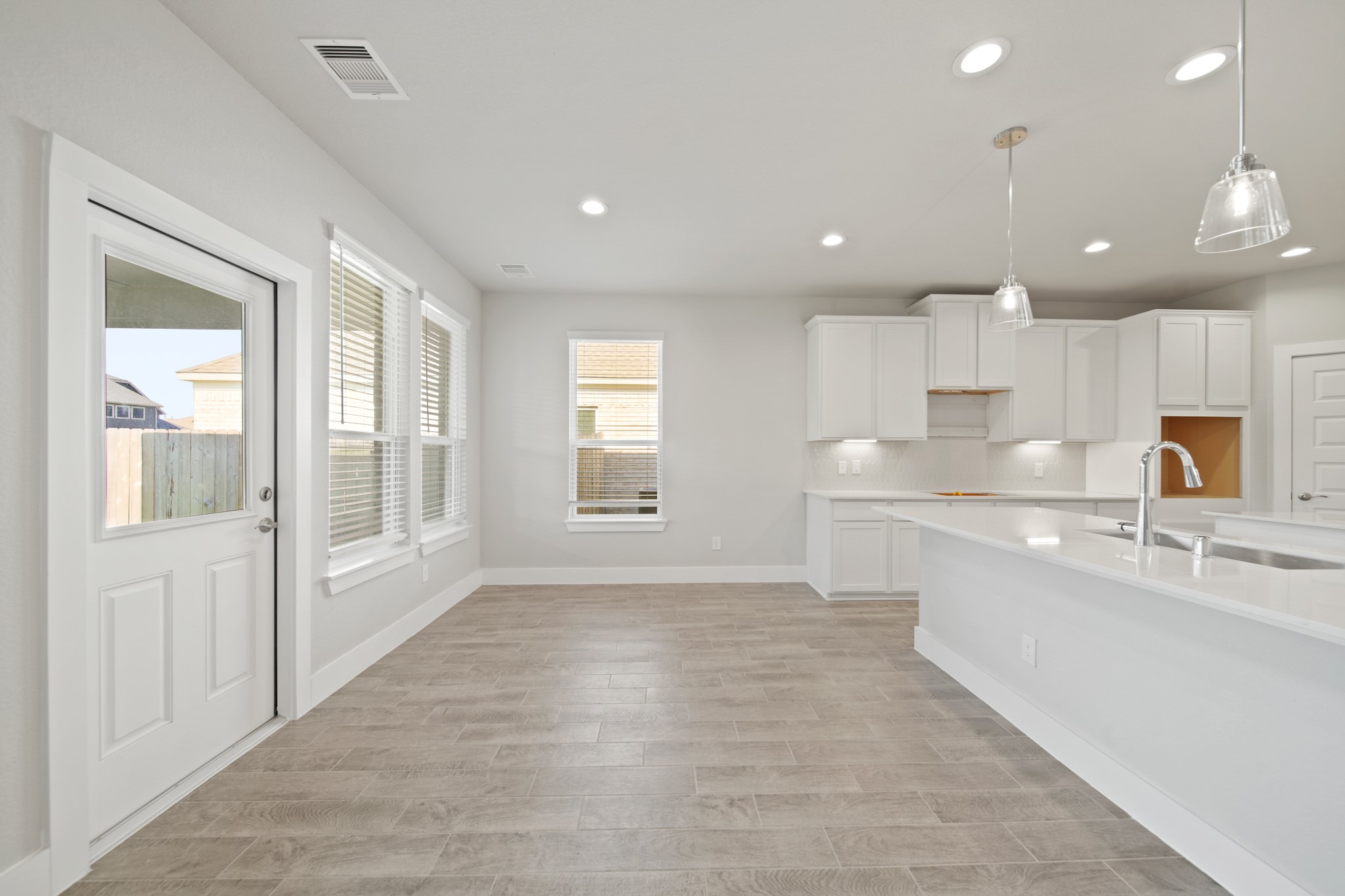 421 Piney Rocks Lane Waller, TX 77484 - Photo 9 of 47 a large white kitchen with a large window