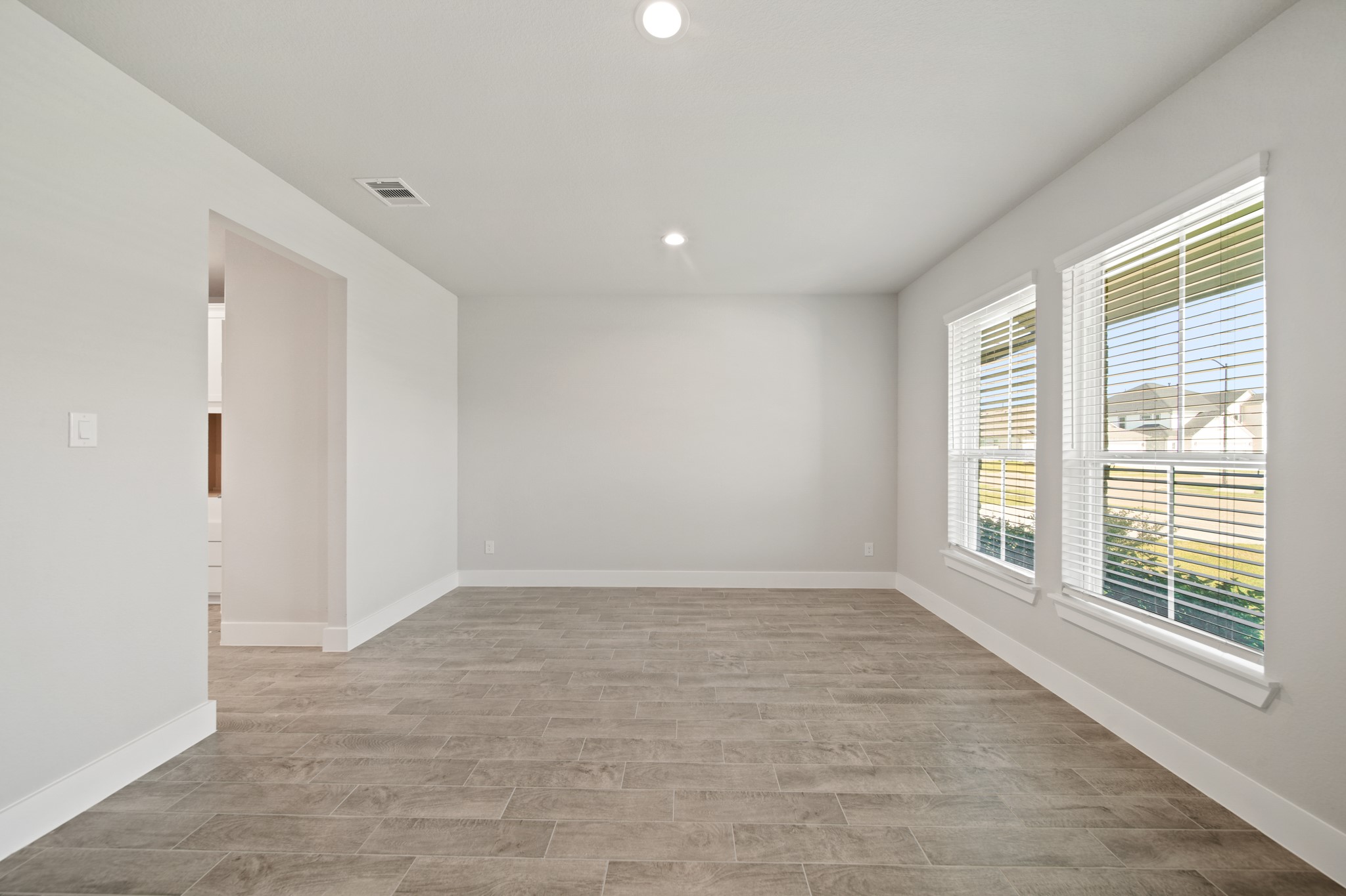 421 Piney Rocks Lane Waller, TX 77484 - Photo 10 of 47 a view of an empty room with a window