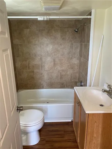 a bathroom with a sink a toilet and a bathtub