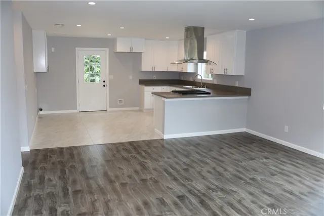 a view of kitchen with wooden floor
