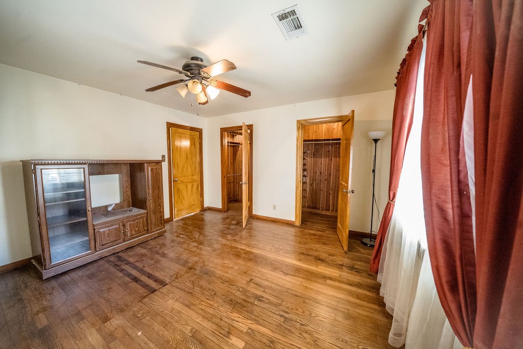 2218 Chapman Street Houston, TX 77009 - Photo 23 of 27 wooden floor in an empty room with a fireplace