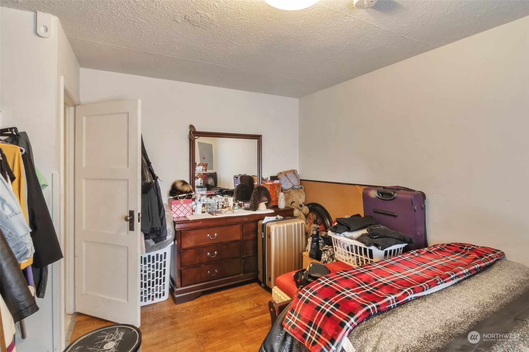 108 Oak Street Bremerton, WA 98310 - Photo 16 of 25 a bed room with a bed and a mirror