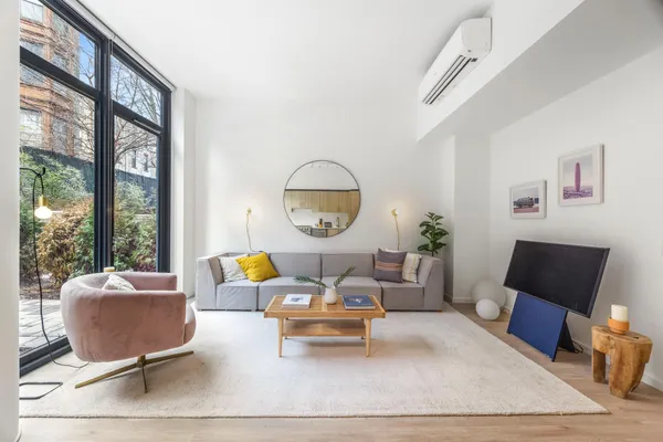 a living room with furniture and a large window