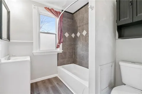 a bathroom with a bathtub and a sink