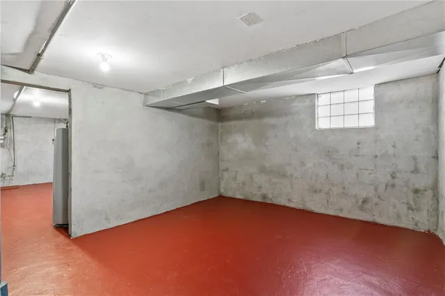 an empty room with a empty space and windows