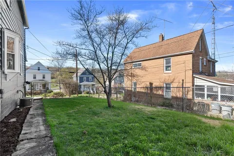 a view of a backyard with a garden